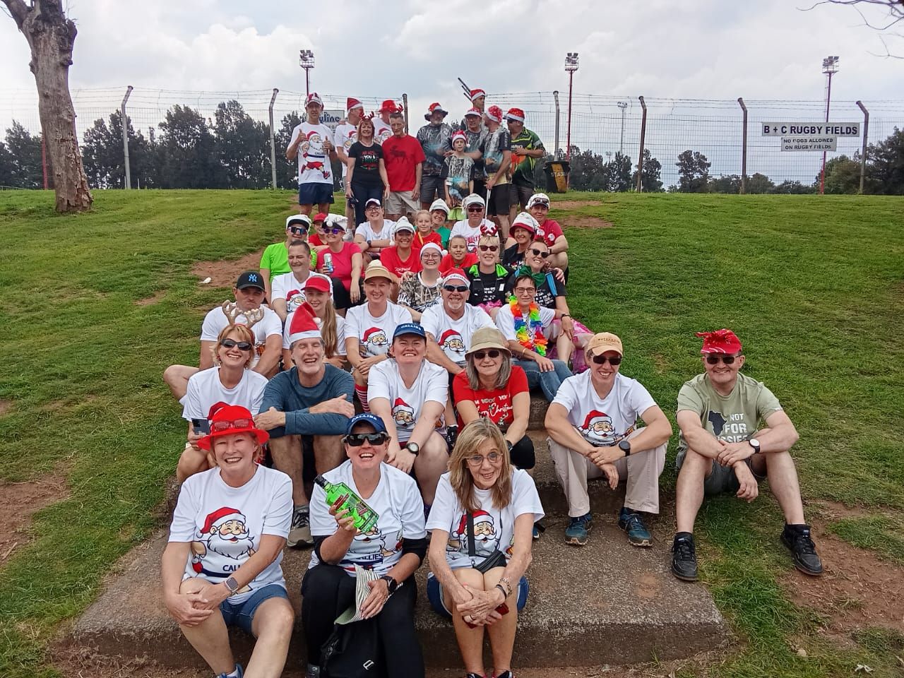 Callies members in Christmas T-shirts and Santa hats at the Grog Jog